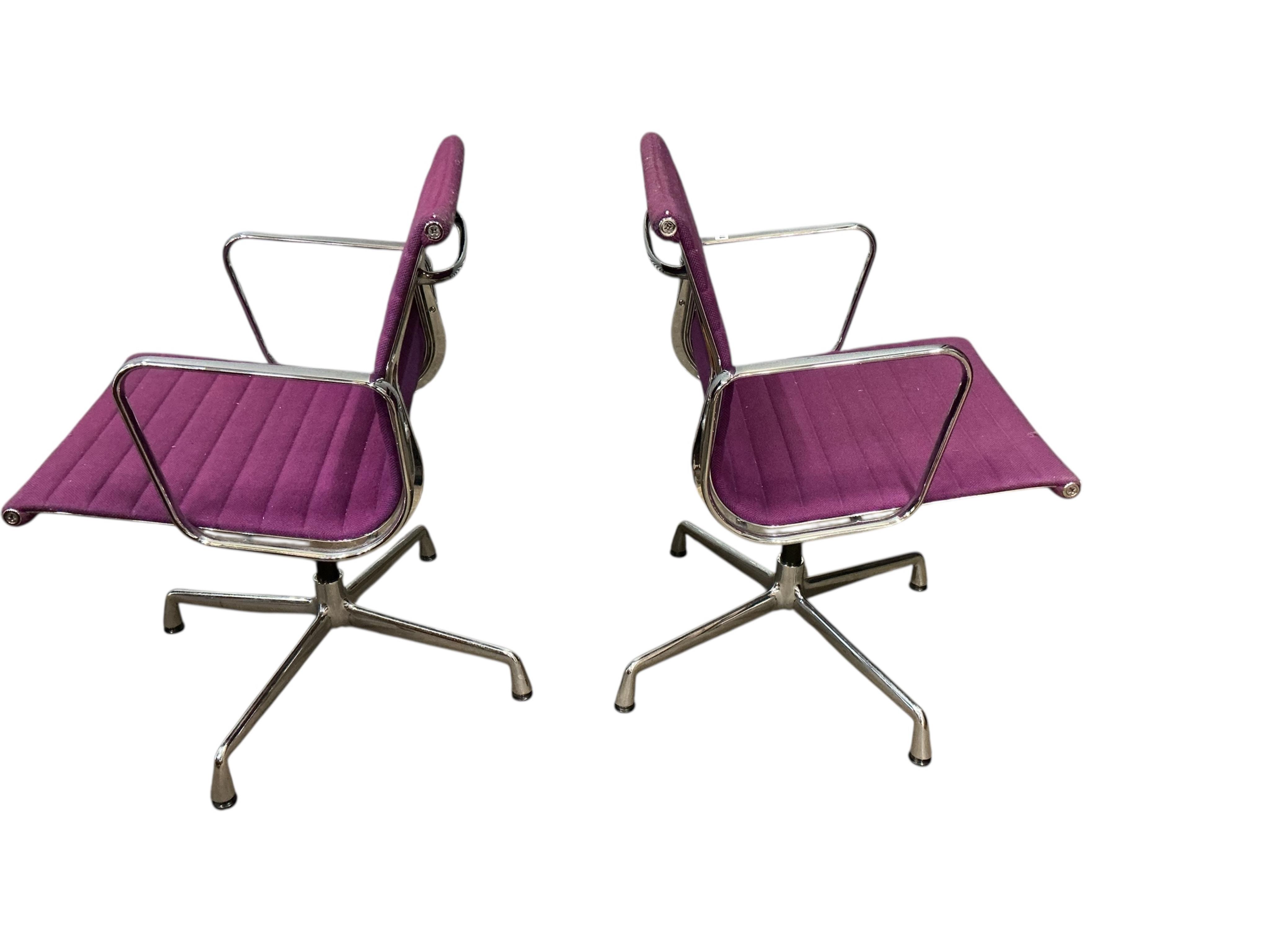 Charles Eames for Vitra, a pair of chrome swivel desk chairs on four prong bases, width 57cm, depth 50cm, height 82cm